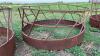 Skirted round bale feeder