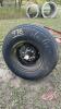 Used 11L-15SL tire on 6-bolt rim