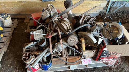 Pallet lot - Angle grinder, 2 Skillsaws, Old Pioneer chainsaw(AS IS), Pullers, Asst of bolts/nuts/draw pins/pulleys, Pintle hitch, Oil pumps, Toolbox, Railroad iron