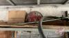 Shelf of Pipe wrench, slow moving sign, sledge hammer, hoses & belting