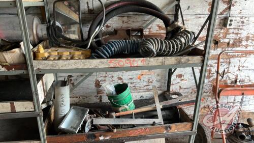 Shelf of air lines, glad hands, rad hose, mirror, square, sledge hammer, pipe wrench & threaded rod