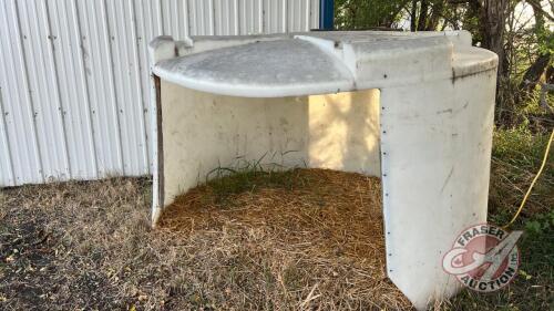 Poly tank converted into calf shelter