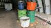 Pallet w/ (2) steel barrels ½ full of grass seed (stored for years), (2) poly tubs, (1) plastic barrel