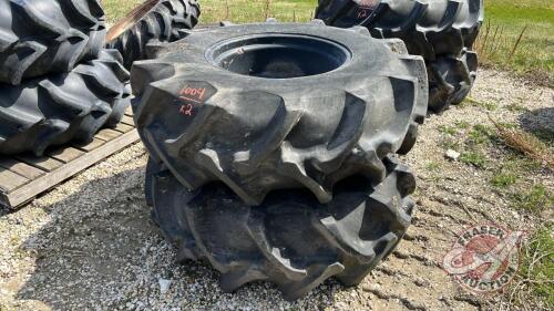 Used 18.4-26 imp tire on black 8 bolt rim