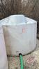 Approx 1250-gal white poly tank (B)