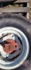 Used 31x13.5-15 tire on rim with stub axle - 2
