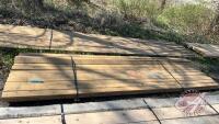Lift of (24) 2" x 4" x 12' pressure treated sienna lumber, F43