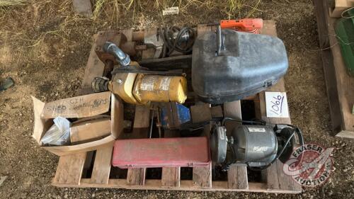 Pallet w/ Poulin Pro 260 chainsaw w/ plastic case, 6&rdquo; bench grinder, road flares, gear box, 5&rdquo; swivel bench vice, electric &frac12;&rdquo; impact, CaseIH 5600 chisel plow bearings and wheel parts