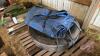 Pallet w/ (Used) Bridgestone 11R24.5 tire on (New) steel bud rim, poly tarp w/ tarp straps