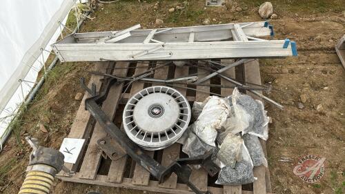 Pallet of lightening rods, metal screws, hub caps, and receiver hitch Pallet K