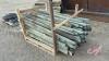 A53 Pallet of Used Treated Fence Posts