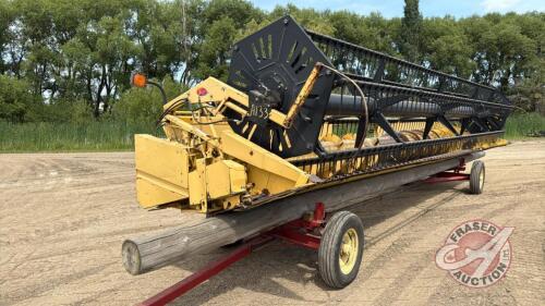 A133 25' New Holland 973 Flex Header **Clips and assorted parts in shed**