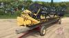 A133 25' New Holland 973 Flex Header **Clips and assorted parts in shed**