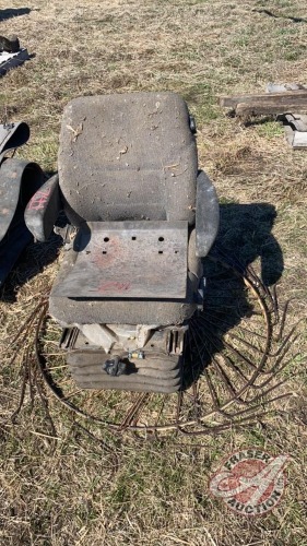 Tractor seat and rake wheel