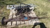 Antique water pump and cinderblocks and folding table legs