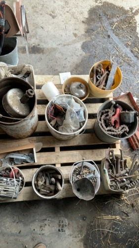 Containers of bolts, assorted roller chain, pail of washers, assorted parts