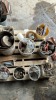 Containers of bolts, assorted roller chain, pail of washers, assorted parts