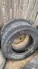 (2) 11R22.5 truck tires 1 has steel rim - 7