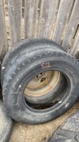 (2) 11R22.5 truck tires 1 has steel rim
