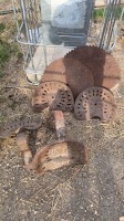 Antique tractor seats and saw blades