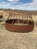 Skirted round bale feeder