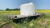 1250-gal poly tank on 4-wheel farm rack