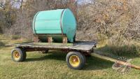 1000-gal poly tank on 12-ton Farm King 4-wheel wagon