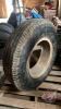 Used Goodyear 9.00-20 tire on rim