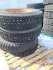 Used 11.00-22 tire on steel rim