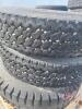 Used 11.00-22 tire on steel rim - 4