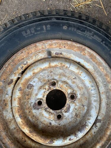 *530-12 Electra trailer tire with 4-bolt rim